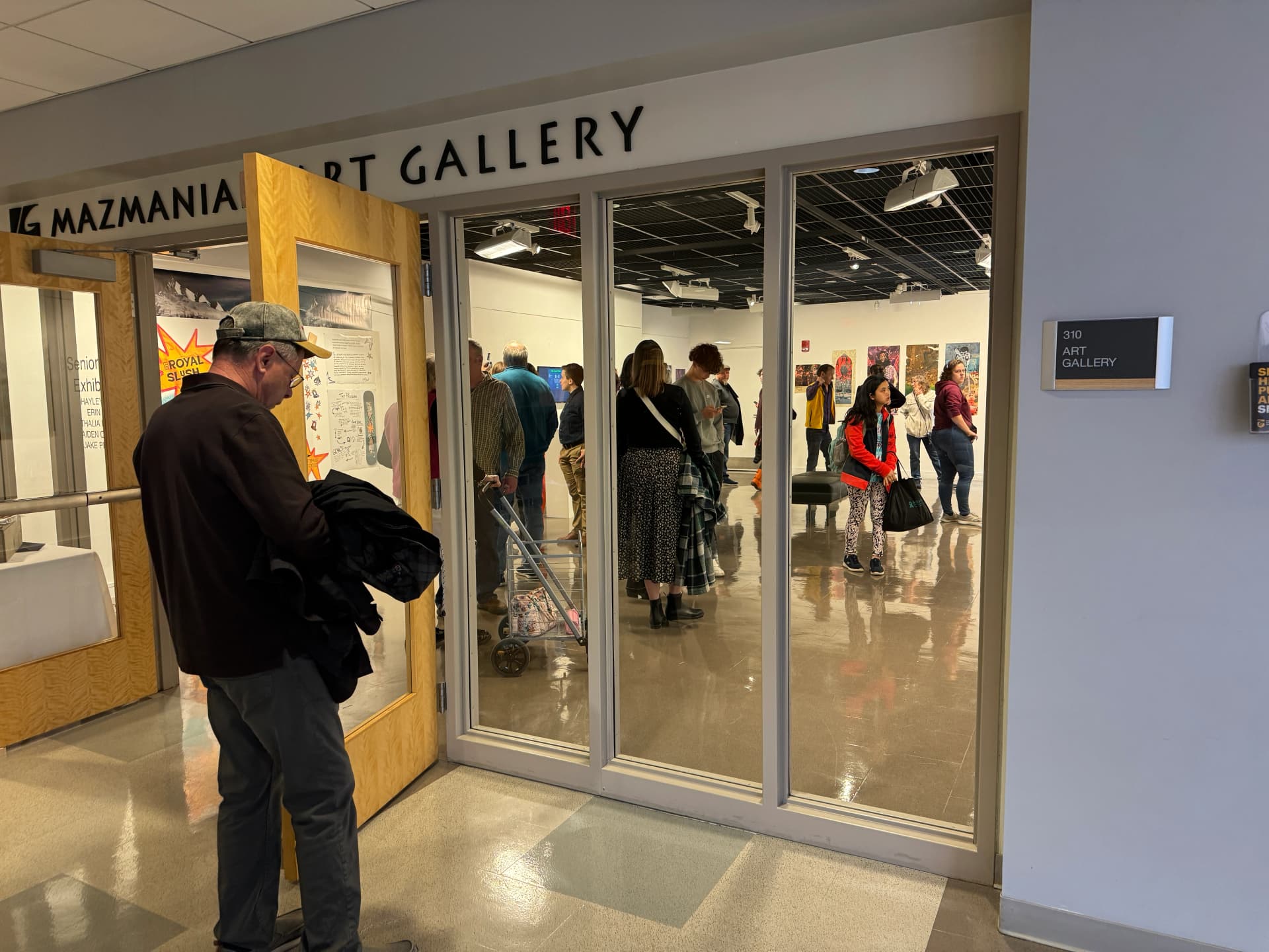 Reception at Mazmanian Art Gallery with visitors viewing The Great Filter exhibition